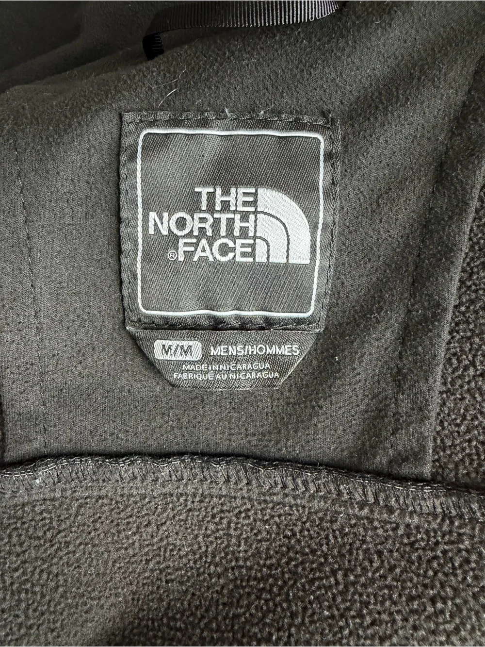 The North Face Men's Black Jacket with Red Accents